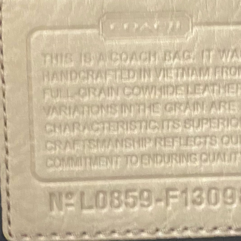 I am selling a crème colored coach purse .